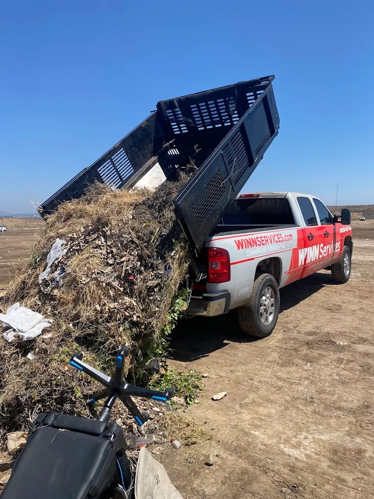 WINN Services dump truck hauling debris